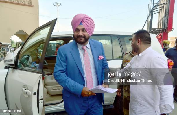 Former Cricketer And Punjab Local Bodies Minister Navjot Singh Sidhu arrives to cross the Attari-Wagah Border on August 17, 2018 near Amritsar,...