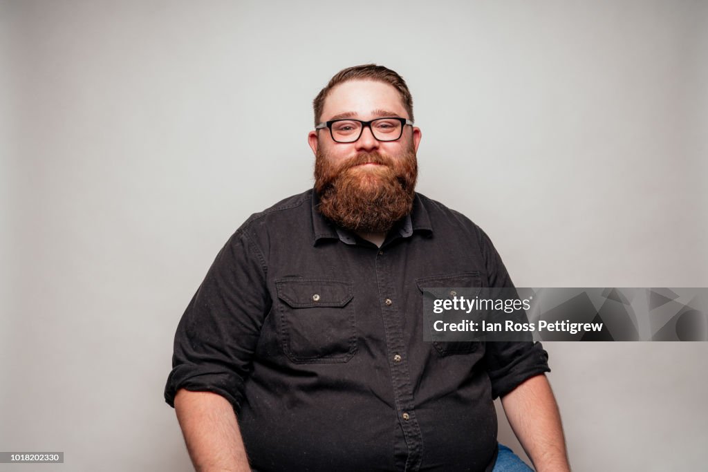 Big man with beard and glasses