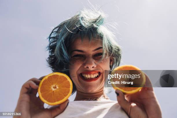 girl with green hair and orange - girl with orange hair stock pictures, royalty-free photos & images