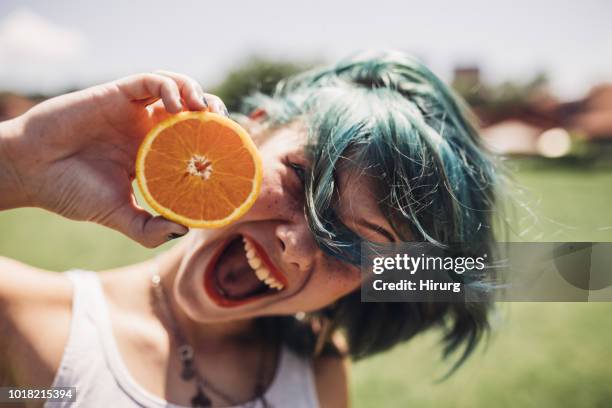 girl with green hair and orange - girl with orange hair stock pictures, royalty-free photos & images