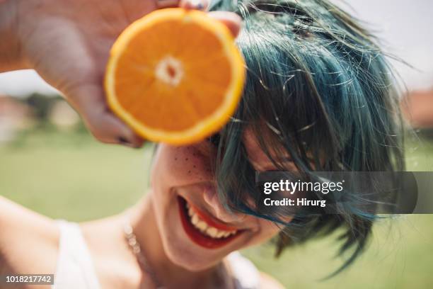 girl with green hair and orange - girl with orange hair stock pictures, royalty-free photos & images