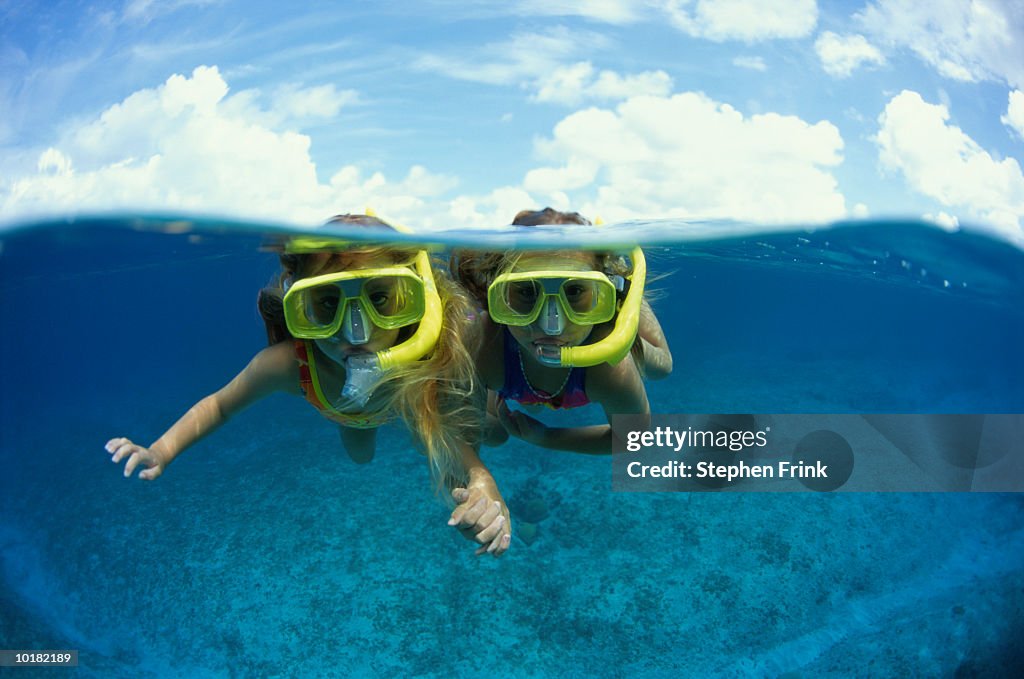 TWO YOUNG GIRLS SNORKELING (CAYMAN)
