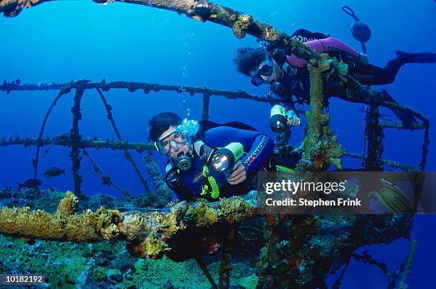divers on the crow's nest of cutter - wreck diving stock pictures, royalty-free photos & images