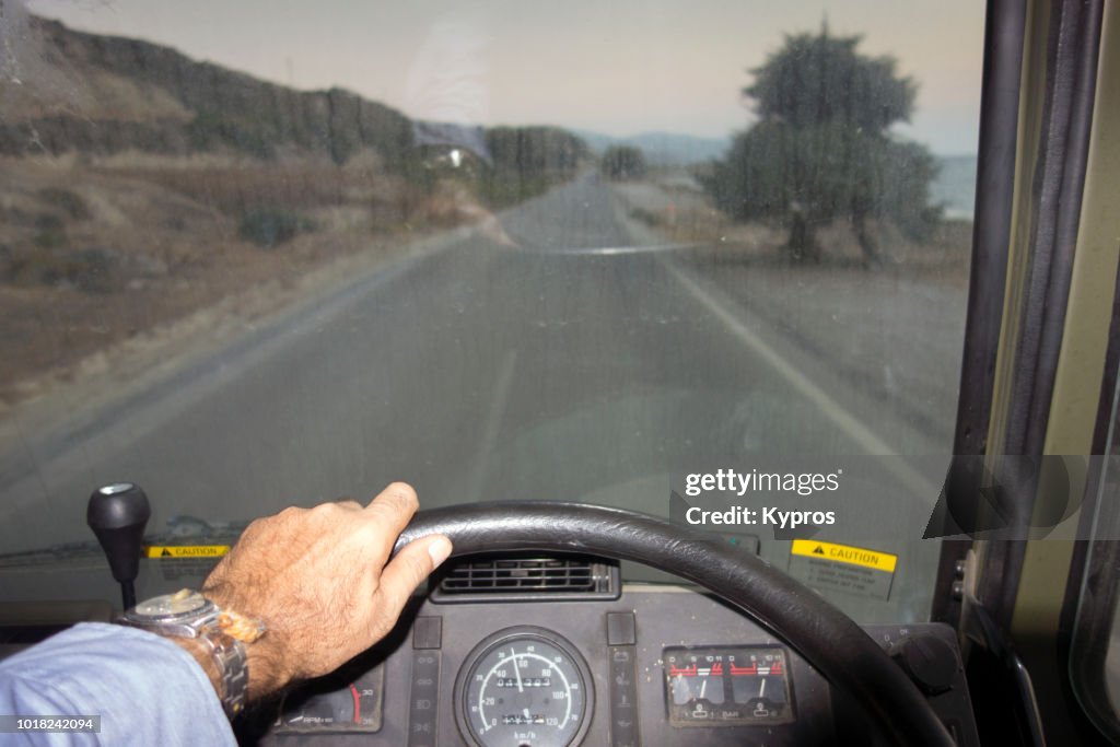 Europe, Greece, 2018: View Of Man Driving Military Truck, View Through Windscreen