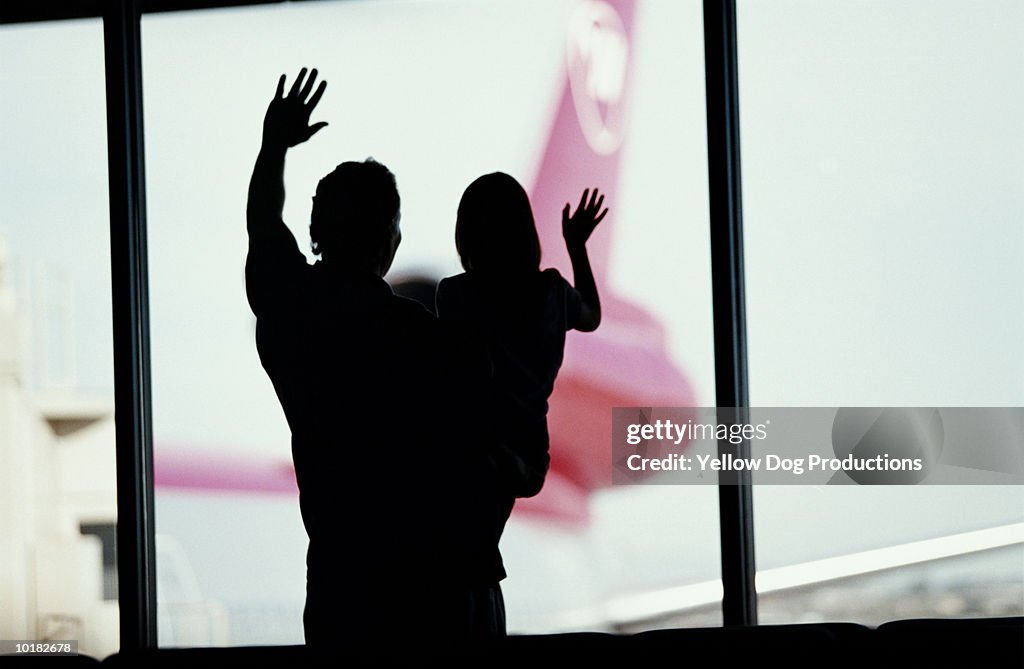FATHER & DAUGHTER WAVING TO AIRPLANES