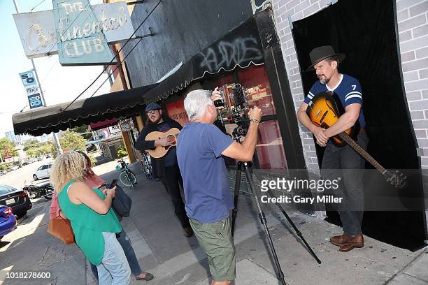 Ben Dickey and Ethan Hawke pose for photos outside the Continental Club to promote the new film "Blaze" on August 17, 2018 in Austin, Texas.