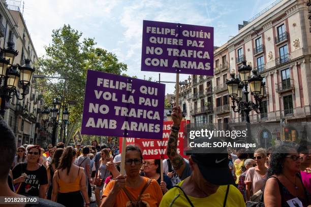 Demonstrators of the Catalan pro-independence left opposing the visit of King Felipe VI are seen on the Ramblas in Barcelona. Barcelona celebrated...