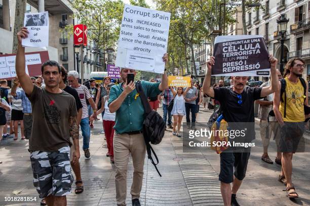 Demonstrators of the Catalan pro-independence left opposing the visit of King Felipe VI are seen on the Ramblas in Barcelona. Barcelona celebrated...