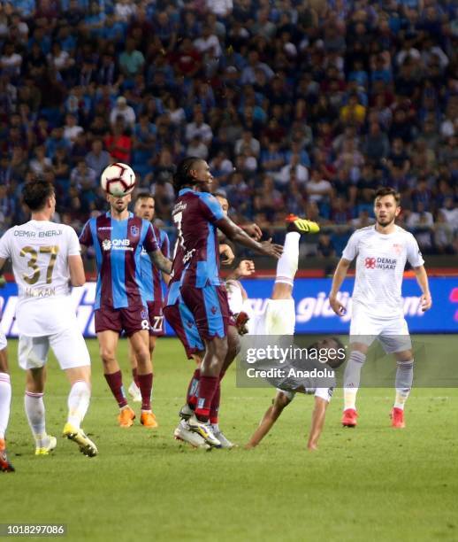 Douglas Pereira of Demir Grup Sivasspor in action against Hugo Rodallega and Olcay Sahan of Trabzonspor during the Turkish Super Lig soccer match...