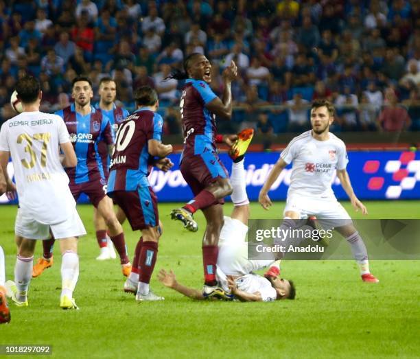 Douglas Pereira of Demir Grup Sivasspor in action against Hugo Rodallega and Olcay Sahan of Trabzonspor during the Turkish Super Lig soccer match...