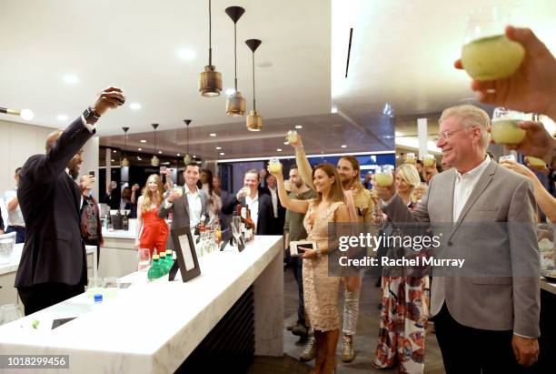 Kofi Nartey toasts with guests during The Nartey Group presents a Sellebrity Toast at Above the Penthouse in The W Residences on August 16, 2018 in...
