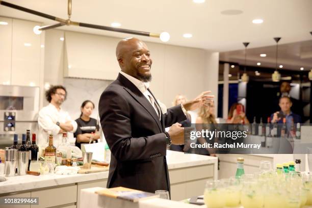 Kofi Nartey toasts with guests during The Nartey Group presents a Sellebrity Toast at Above the Penthouse in The W Residences on August 16, 2018 in...