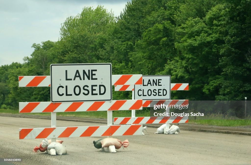 Road closed sign and barricade on a highway