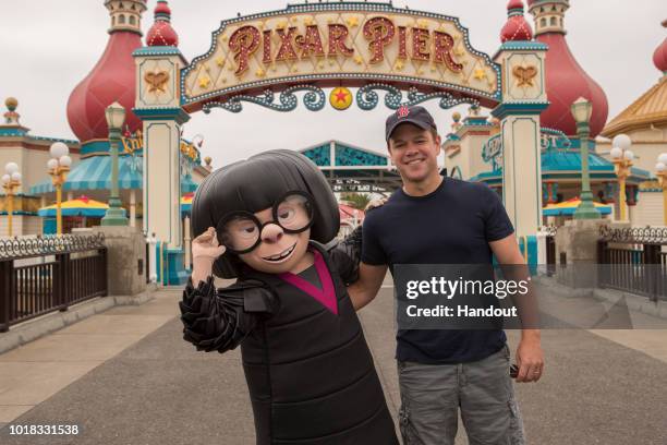 In this handout image provided by Disneyland Resort, actor Matt Damon meets Edna Mode from "Incredibles 2" at the new Pixar Pier in Disney California...