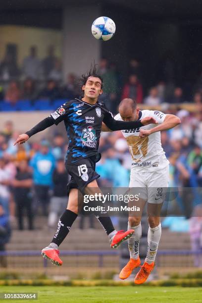 Jose Martinez of Pachuca and Carlos Gonzalez of Pumas fight for the ball during the fourth round match between Pumas UNAM and Pachuca as part of the...