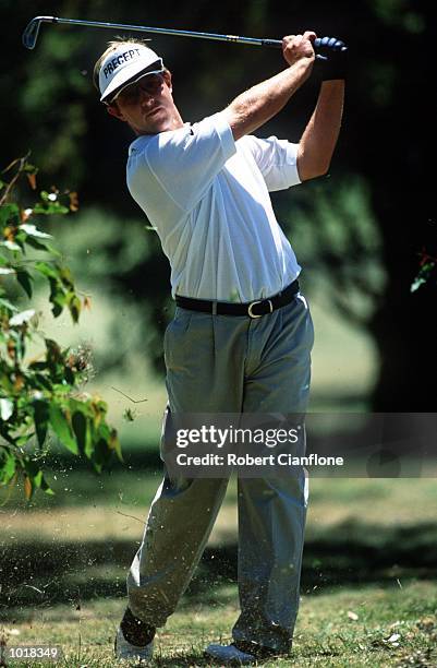 Scott Laycock hits out of the rough on the sixth fairway ,during the third round of the Smoke Free Victorian Open played at the Cranbourne Golf...