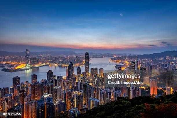 view at the peak observation point of hong kong city and building in the morning sunrise - victoria harbour hong kong stock-fotos und bilder