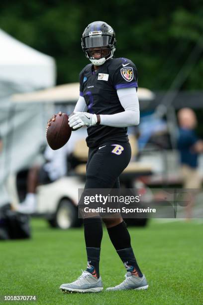 Baltimore Ravens quarterback Robert Griffin III warms up before the Indianapolis Colts joint training camp practice with the Baltimore Ravens on...