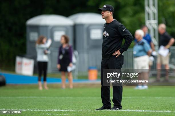 Baltimore Ravens head coach John Harbaugh watches a drill during the Indianapolis Colts joint training camp practice with the Baltimore Ravens on...