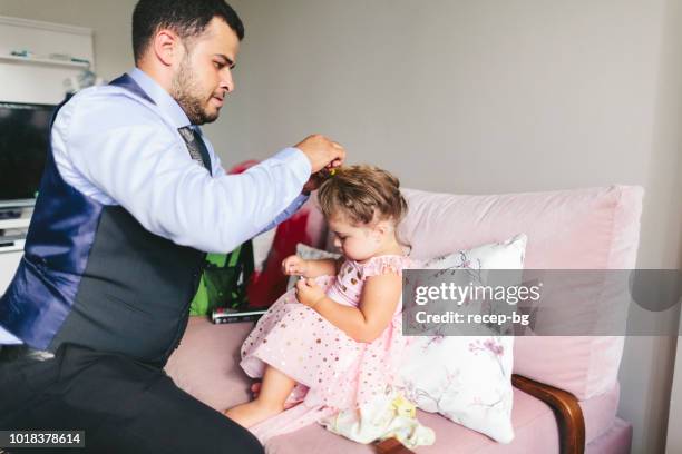 father fixing his daughters hair - adjusting hair stock pictures, royalty-free photos & images