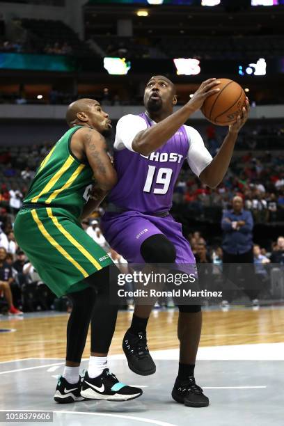 Mario West of the Ghost Ballers drives to the basket against Andre Owens of the Ball Hogs during week nine of the BIG3 three-on-three basketball...