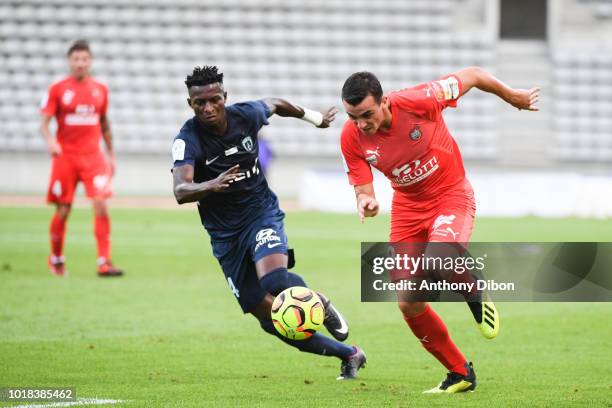 Edmond Akichi Ogou of PFC and Antoine Rabillard of Beziers during the French Ligue 2 match between Paris FC and Beziers at Stade Charlety on August...