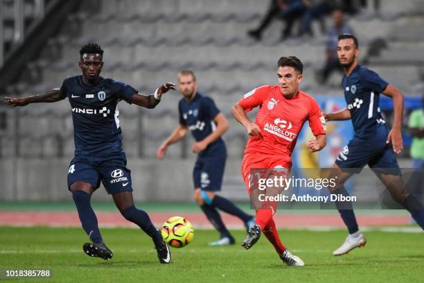 Ogou Akichi of PFC and Steve Beusnard of Beziers during the French Ligue 2 match between Paris FC and Beziers at Stade Charlety on August 17, 2018 in...