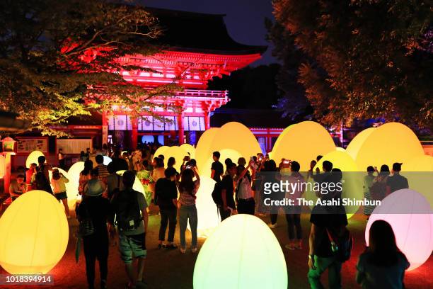 Visitors enjoy the illumination art of the 'Forest of Tadasu at Shimogamo Shrine' on August 17, 2018 in Kyoto, Japan.