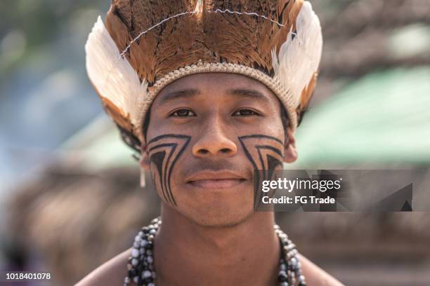 indigenous brazilian young man portrait from guarani ethnicity - brazil body paint stock pictures, royalty-free photos & images