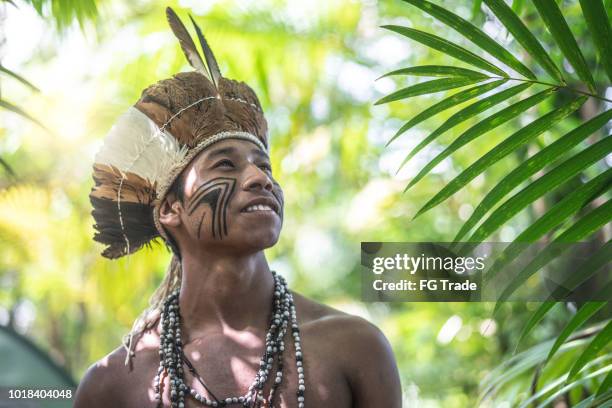 indigenous brazilian young man portrait from guarani ethnicity - tribals stock pictures, royalty-free photos & images