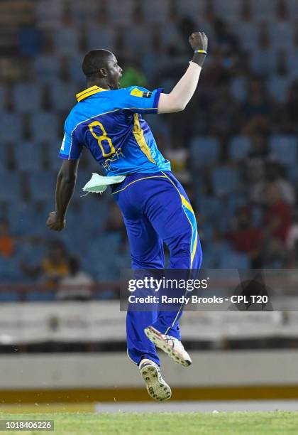 In this handout image provided by CPL T20, Jason Holder of Barbados Tridents celebrates the dismissal of David Warner of St Lucia Stars during match...