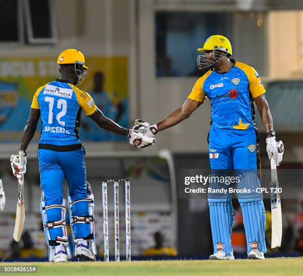 In this handout image provided by CPL T20, Andre Fletcher Kieron Pollard of St Lucia Stars partnership during match 10 of the Hero Caribbean Premier...