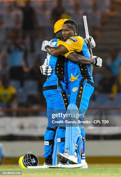 In this handout image provided by CPL T20, Darren Sammy and Kieron Pollard of St Lucia Stars during match 10 of the Hero Caribbean Premier League...