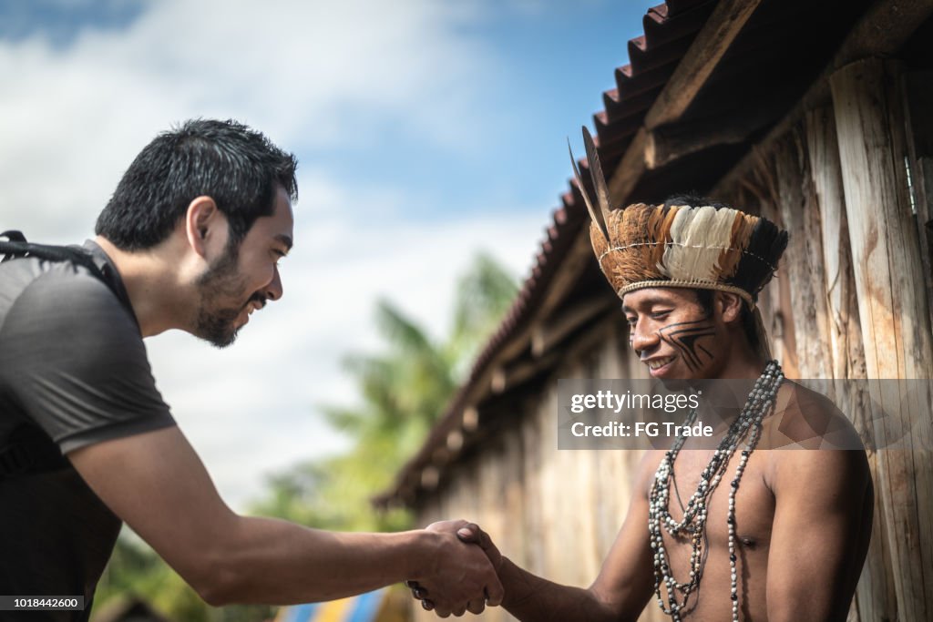 Indigenous Brazilian Young Man Portrait from Guarani ethnicity, Welcoming the tourist