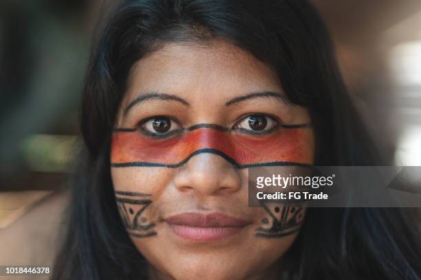 indigenous brazilian young woman portrait, from guarani ethnicity, in a hut - closeup - tribal stock pictures, royalty-free photos & images