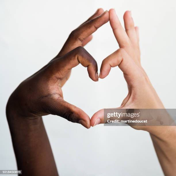 Skin Colors Hands Photos and Premium High Res Pictures - Getty Images