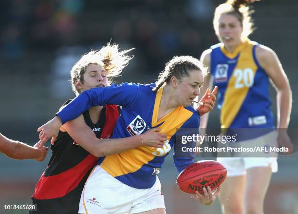 Jacinta Reid of Williamstown is tackled during the VFLW round 15 match between Essendon and Williamstown at Windy Hill on August 18, 2018 in...