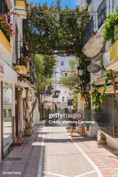 alley in the old own of marbella, spain - malaga province stock pictures, royalty-free photos & images