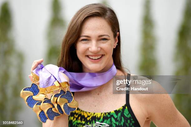 In this handout image provided by Swimming Australia, Cate Campbell poses with the five gold medals she won at the Pan Pacific Swimming Championships...