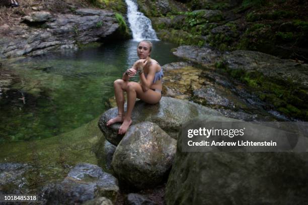 Jade Lichtenstein gets ready to swim in the cold mountain stream water of Rattlesnake Pool on August 10, 2018 in Stow, Maine.