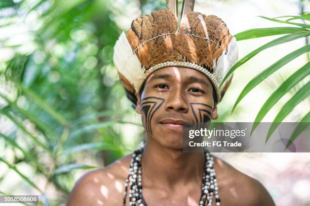 indigenous brazilian young man portrait from guarani ethnicity - brazil body paint stock pictures, royalty-free photos & images