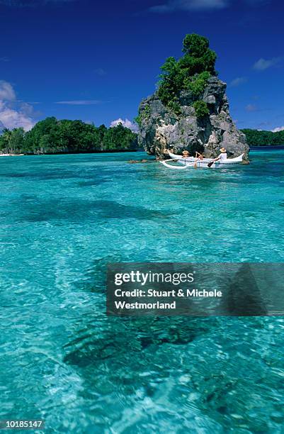 outrigger canoeing in rock islands - palau stock pictures, royalty-free photos & images
