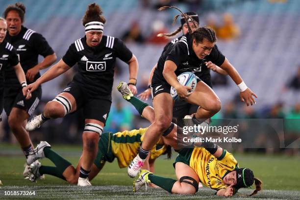 Theresa Fitzpatrick of the Black Ferns jumps over a Wallaroos defender during the Women's Rugby International match between the Australian Wallaroos...