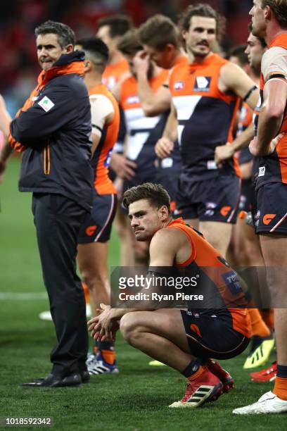 Stephen Coniglio of the Giants and Leon Cameron, coach of the Giants, look dejcted after the round 22 AFL match between the Greater Western Sydney...
