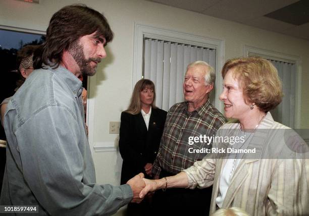 Teddy Gentry of Country Group Alabama, Former President Jimmy Carter and Former First Lady Rosalynn Carter backstage at Peachtree City Amphitheater...