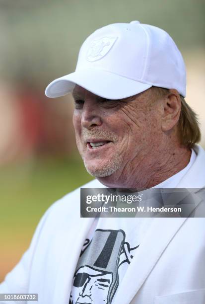 Owner Mark Davis of the Oakland Raiders looks on while his team warms up prior to the start of a preseason NFL football game against the Detroit...