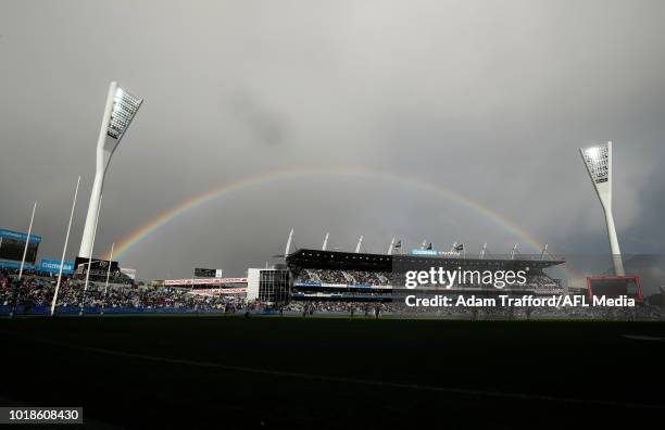 Rainbow is seen over the Red Hickey stand during the 2018 AFL round 22 match between the Geelong Cats and the Fremantle Dockers at GMHBA Stadium on...