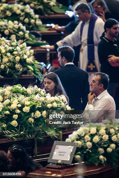 Mourners gather around the coffins during a State funeral service for the victims of the Morandi Bridge disaster at the Fiera di Genova exhibition...