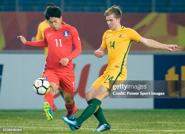 Riley Patrick Mcgree of Australia in action against Cho Young Wook of South Korea during the AFC U23 Championship China 2018 Group D match between...