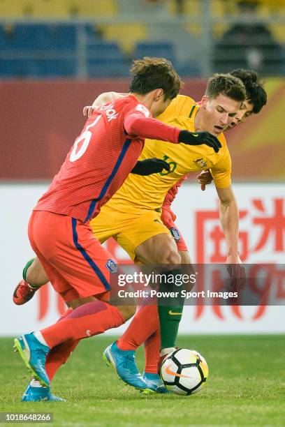 Ajdin Hrustic of Australia fights for the ball with Hwang Ki Wook of South Korea during the AFC U23 Championship China 2018 Group D match between...